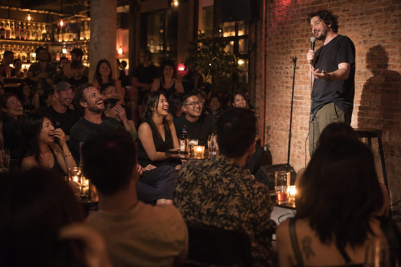 A comedian on stage at a stand-up comedy night