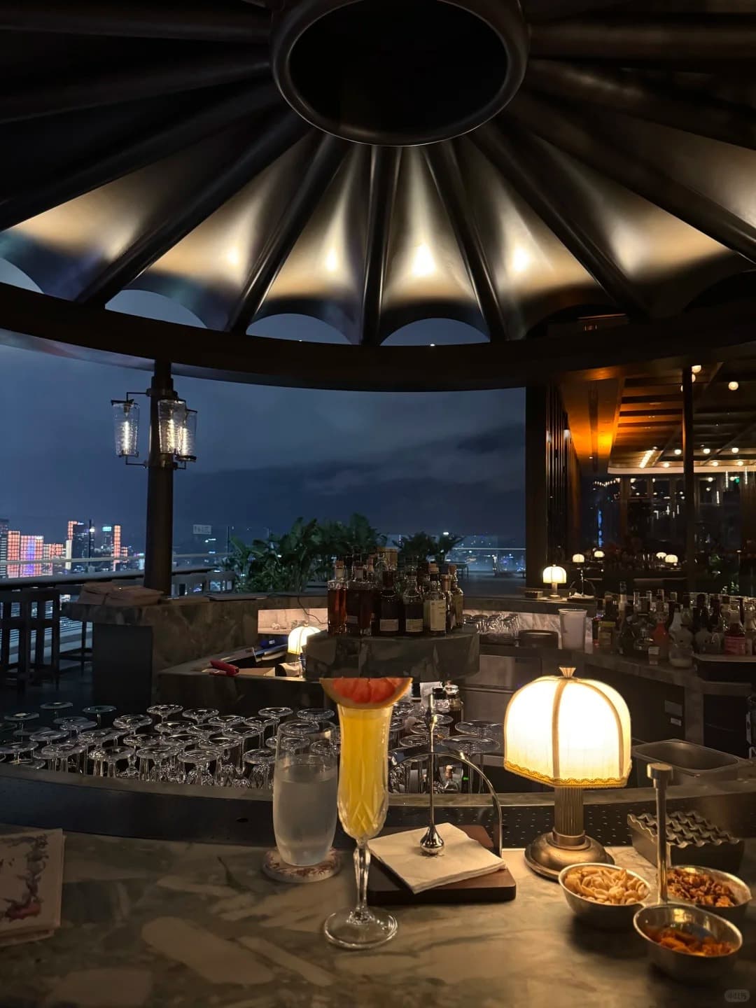A drink under the canopy of the Astor Terrace Bar, 51/F