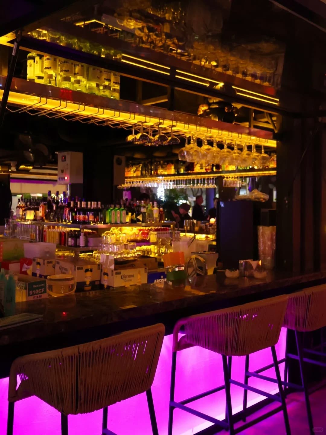 The OASIS bar with its pink-lit counter
