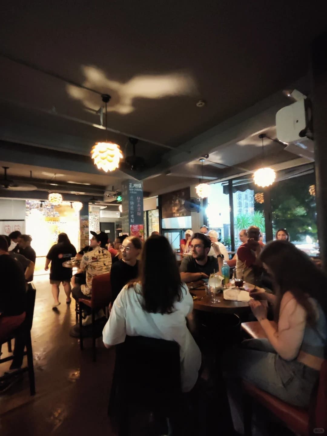 Inside Craft Head's upstairs taproom on a busy evening
