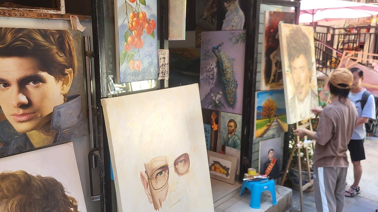 Easels and canvases outside a Dafen studio